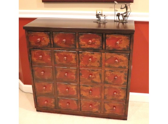 Apothecary Style Cabinet With Small Metal Art Sculptures