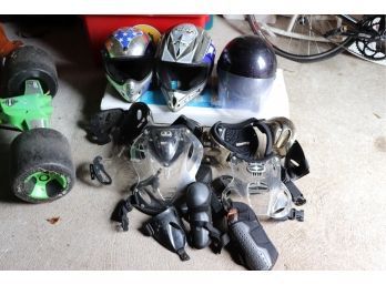 Lot Of Dirt Bike Helmets And Riding Gear