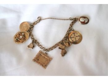 14K YG Charm Bracelet With 8 14K YG  Charms (22.8 Dwt Tw) Includes Sm Cameo, Clover, Heart & More