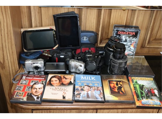 Mixed Lot Of Assorted Cameras, Handheld Devices, And DVDs, As Is Condition