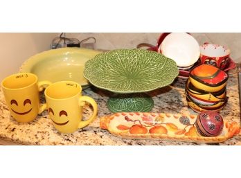 Mixed Lot Of Assorted Dishware Includes Cake Tray, Coffee Mugs, And Serving Dishes