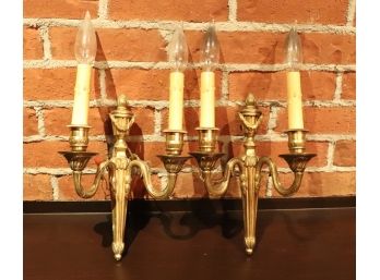 Pair Of Ornate Dual Arm Candlestick Style Wall Sconces With Brass Tone Finish