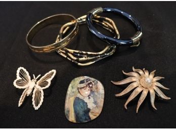 Assortment Of Bangles And Brooches