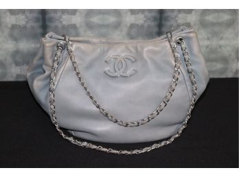 Womens Grey Chanel Bag With Metal Chain Strap Shows Some Fading Along Sides And Edges
