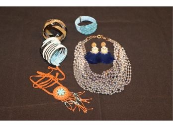 Womens Fashion Jewelry Includes Fun Beaded Necklaces, Twisted Bead Bracelets And Shiny Blue Dangle Earrings