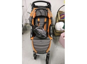 B.O.B. Orange And Grey Stroller With Canopy Folds Up With Lots Of Storage For Baby Items
