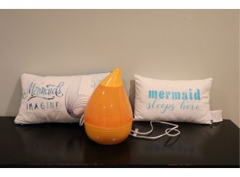 Decorative Mermaid Pillows And Small Orange Crane Humidifier