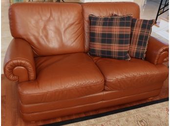 Cognac Colored Leather Roll Arm Loveseat With 2 Coordinating Plaid Throw Pillows