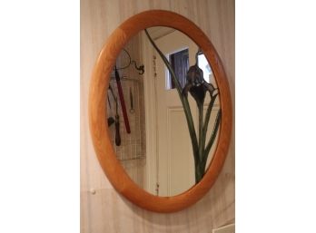 OVAL WALL MIRROR WITH LEADED FLORAL SLAG GLASS DETAIL IN WOOD FRAME MEASURES 19 W X 23 TALL