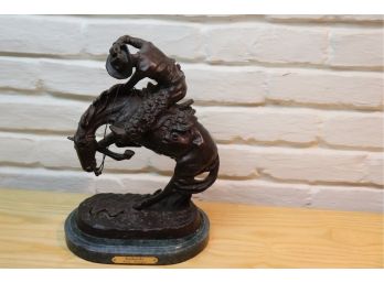 . RATTLESNAKE BRONZE BY FREDERICK REMINGTON ON A MARBLE BASE, APPROXIMATELY 10 W X 8 D X 14 TALL