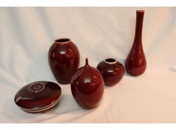 LOT OF DECORATIVE SIGNED CERAMICS IN CRANBERRY COLOR, MARKED ON BOTTOM INCLUDES ASSORTED STYLES OF VASES