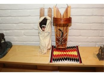 NAVAJO STYLE PORCELAIN BABY DOLL WRAPPED IN MINK FUR WITH HANDMADE STAINED WOOD PAPOOSE & HANDWOVEN RUG