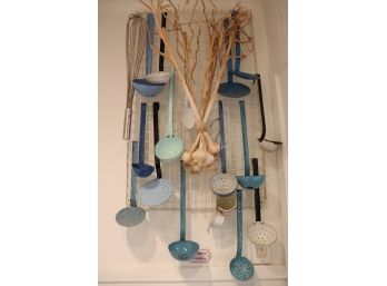 VINTAGE ENAMELED WARE COOKING UTENSILS INCLUDES A VARIETY OF BLUE SPOONS, LADELS, AND STRAINERS