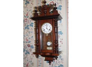 ANTIQUE JUNGHANS R. A REGULATOR WALL CLOCK WITH CARVED FLORAL DETAIL AND DECORATIVE FINIALS