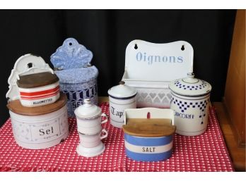 VINTAGE ENAMELED WARE INCLUDES EUROPEAN SALT BOXES, ONION RACK, PORCELAIN MATCH BOX MADE IN FRANCE & CANISTERS