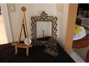 VINTAGE ORNATE BRASS FRAME 12 W X 16 TALL WITH BRASS OIL LAMP AND DECORATIVE EASEL 18 TALL