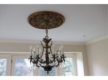 ELEGANT BRASS CHANDELIER WITH 8 ORNATE ARMS AND CHERUB DESIGN MEASURES 24 W X 24 TALL