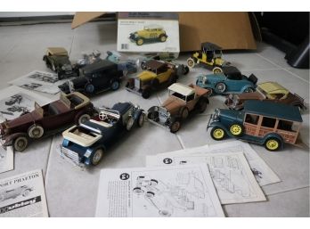COLLECTION OF PRE-BUILT MODEL CARS WITH SOME MANUALS (MAY BE MISSING PARTS OR PIECES)