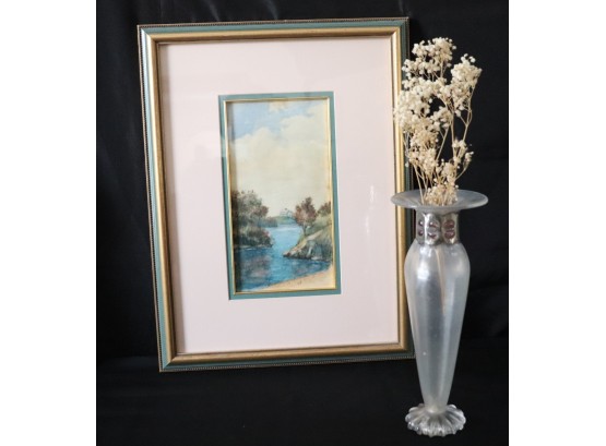 WATERCOLOR LANDSCAPE IN A BLUE & GOLD COLORED MATTED FRAME WITH SIGNED IRIDESCENT FINISHED VASE