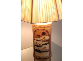 BEAUTIFUL HAND THROWN POTTERY LAMP WITH CARVED SCENERY ALONG THE SIDE