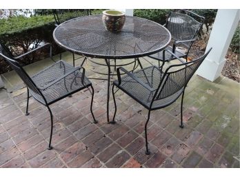 WROUGHT IRON OUTDOOR TABLE SET WITH 4 CHAIRS NEEDS TO BE SANDED & PAINTED 42 INCH DIAMETER TABLE WITH PLANTER