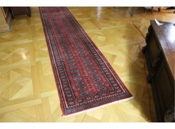 LONG HANDMADE BOKHARA PATTERN RUNNER WITH TRADITIONAL RICH RED COLOR. 31' W X 117 ' L