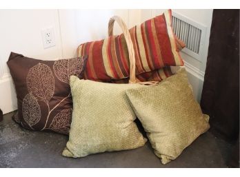 Collection Of Decorative Pillows With Basket