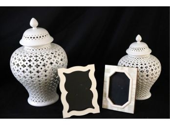 Pair Of Decorative Urns By Twos Company With A Pierced Design Includes 2 Picture Frames