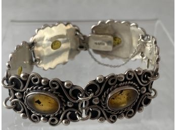 Lovely Six Section Amber And Sterling Silver Bracelet In A Fancy Scroll Design