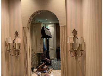 Pair Of Mirrored Wall Sconces With A Brass Finish