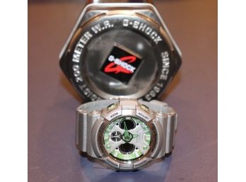Grey G Shock Watch From Casio With Green Face 200 Meter Water Resistant With Case
