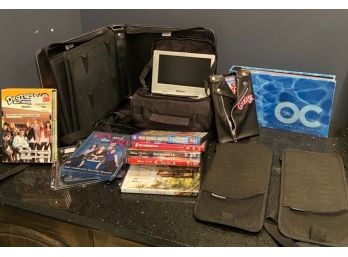 Portable DVD Player With Assorted DVDs