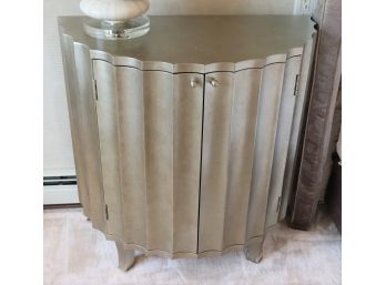 Antiqued Silver Side Cabinet With A Curved Design