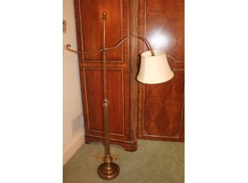 Vintage Style Adjustable Brass Floor Lamp With A Scrolled Design