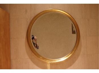 Pretty Rounded Gilded Wall Mirror With A Beveled Edge