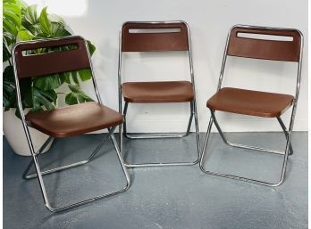 Vintage Trio Of Cosco Chrome And Brown Plastic Folding Chairs