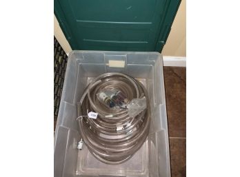 Clear Bin With Tubing And Other Miscellaneous Items