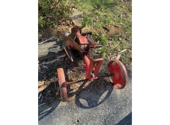 Red Metal Wheeled Attachment - Unsure Of What Purpose Is