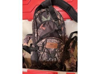 Box Of Camo Backpacks And Fanny Packs