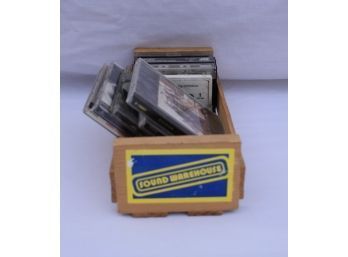 A Wooden Crate With Cd's And Cassettes From Legendary Sound Warehouse