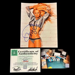 PAMELA ANDERSON SIGNED AUTOGRAPH PHOTO WITH PHOTO OF HER SIGNING