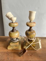 PAIR OF STONE AND BRASS LAMP BASES