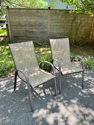 PAIR OF OUTDOOR STACKING ARMCHAIRS