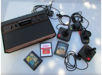 Vintage Atari Gaming System With Controllers And Paddles
