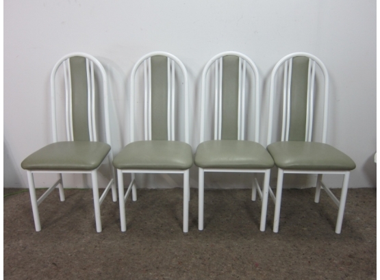 A Set Of 4 White Metal Chairs