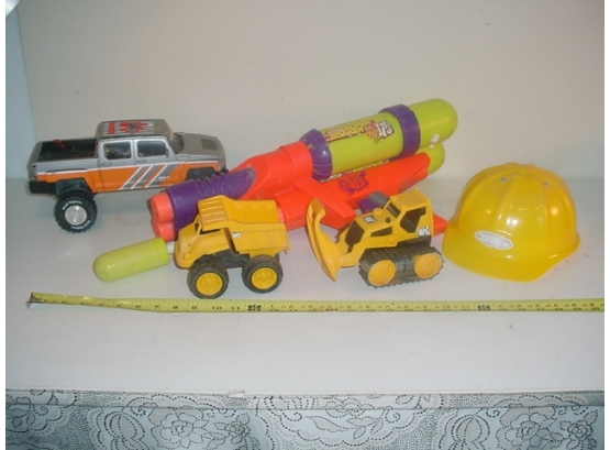 Toys: 24' Super Soaker, Battery Operated Hummer, Tonka Hard Hat, 2 Plastic Trucks  (262)