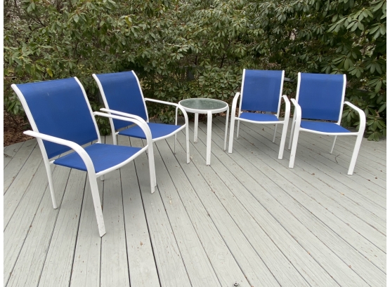 Four Blue And White Outdoor Chairs With Metal And Glass Round Side Table