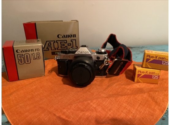 Canon AE-1 35mm Camera With Strap, Two Rolls Of Film And Additional Lens