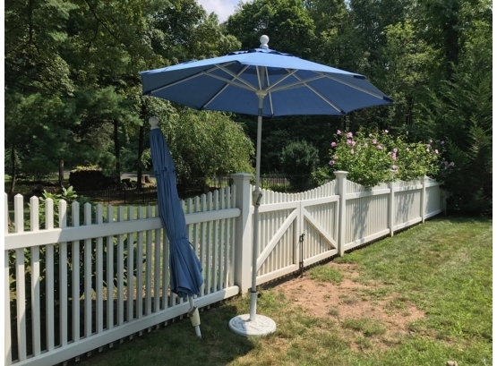 Two Patio Umbrellas And A Stand