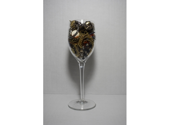 A Glass With Class  A Crystal Glass Filled With Several Pieces Of Jewelry